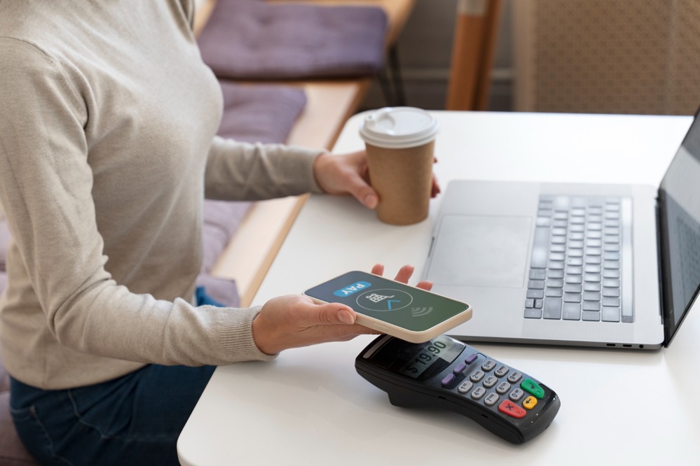 person-paying-using-nfc-technology_1.jpg