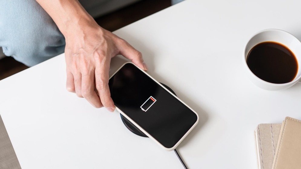 person-trying-charge-his-smartphone-wireless-battery-charger.jpg