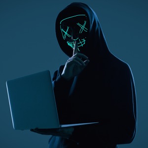 anonymous-man-black-hoodie-neon-mask-hacking-into-computer.jpg